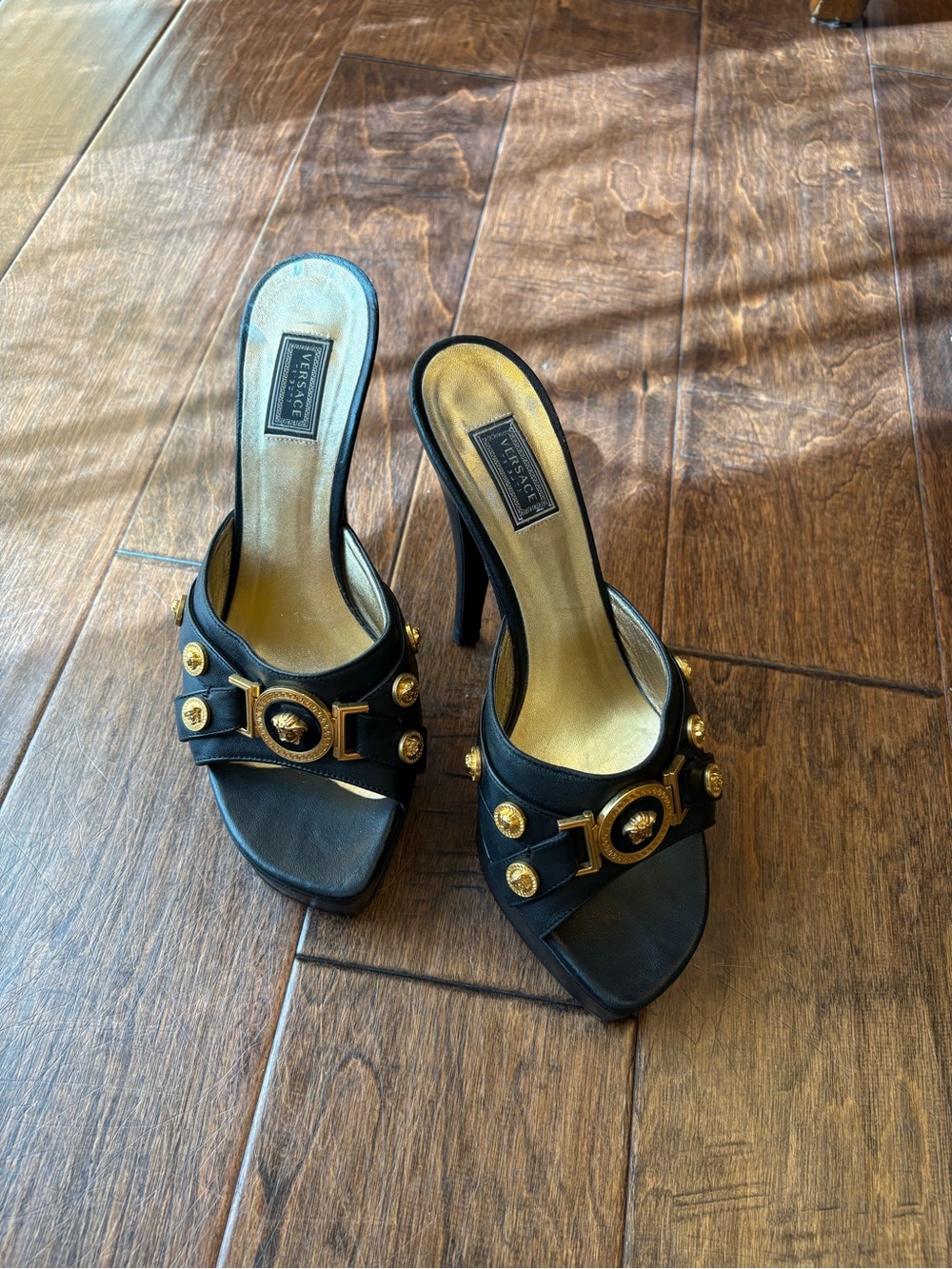 Versace Black Heeled Slide Sandals with Gold Medallion Accents